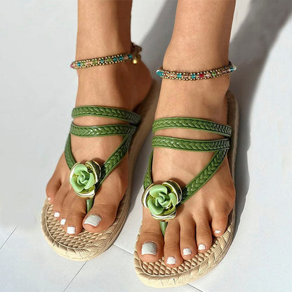 Woven sandals with floral embellishment