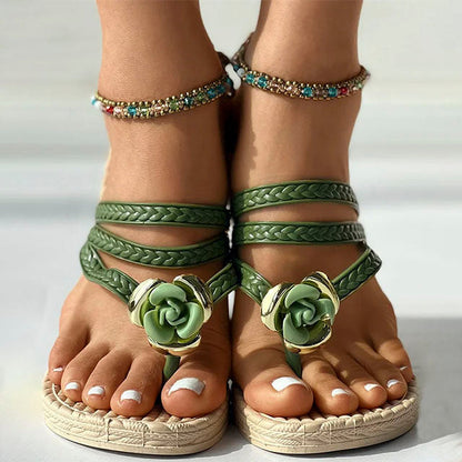 Woven sandals with floral embellishment