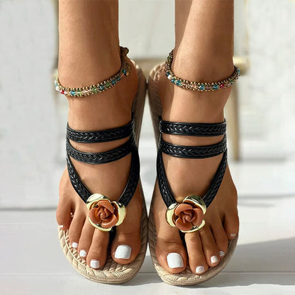 Woven sandals with floral embellishment