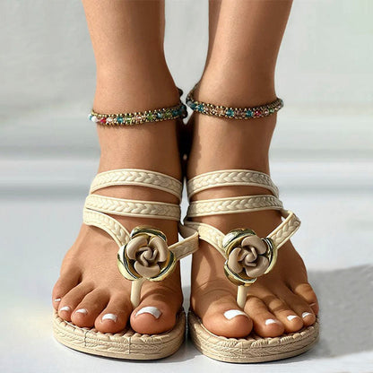 Woven sandals with floral embellishment