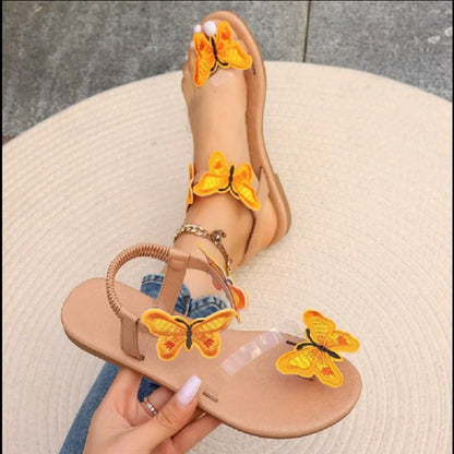 Flat sandals with butterfly decoration for women